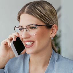 A professional woman smiles while discussing her career goals.